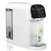 White countertop water filter dispensing pure water into glass with lime slices