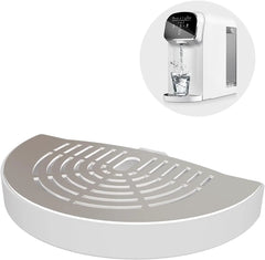 White countertop water dispenser with drip tray, dispensing purified water into glass
